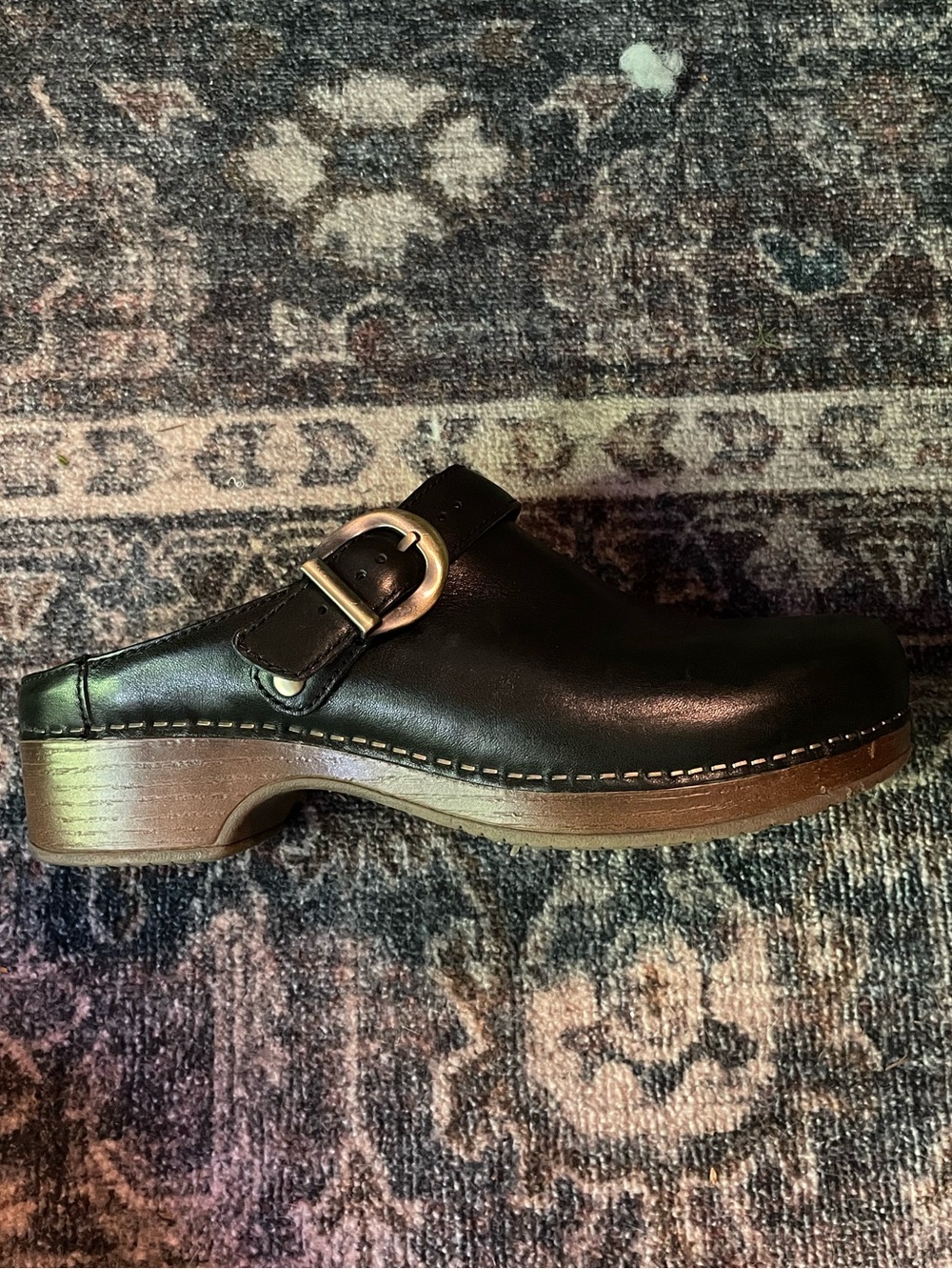 Baylor black buckle clogs by dansko